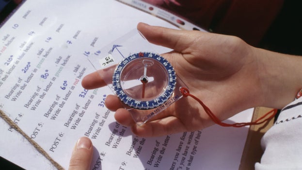 Close-up of an orienteering schedule & compass at Brancaster being used as part of the programme provided for children by the Activity Centre.